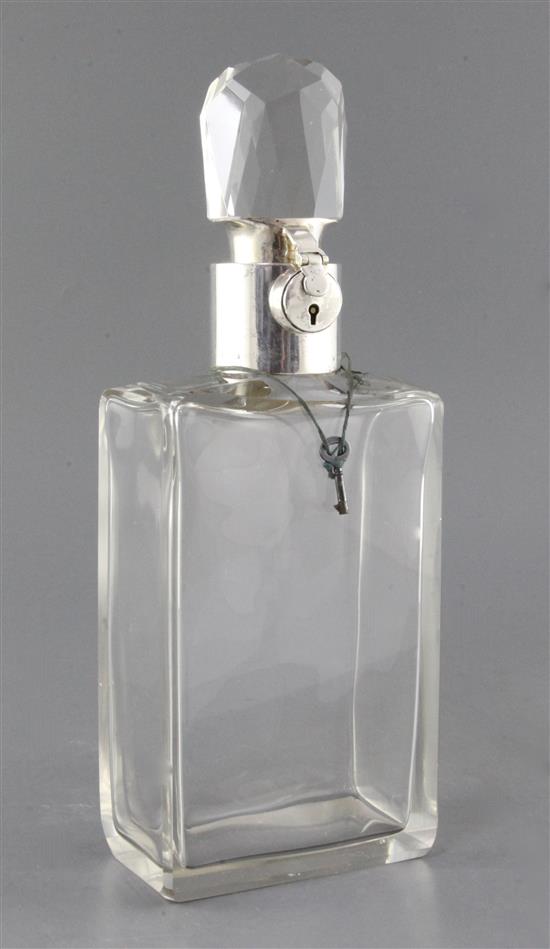 A George V silver mounted plain glass lockable decanter by Asprey & Co Ltd, 32.5cm.